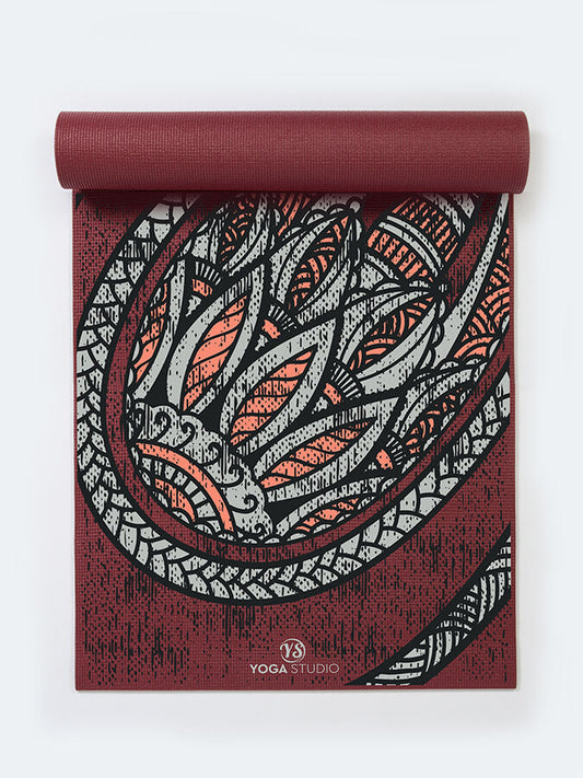 Yoga mat with dragon design on a white background