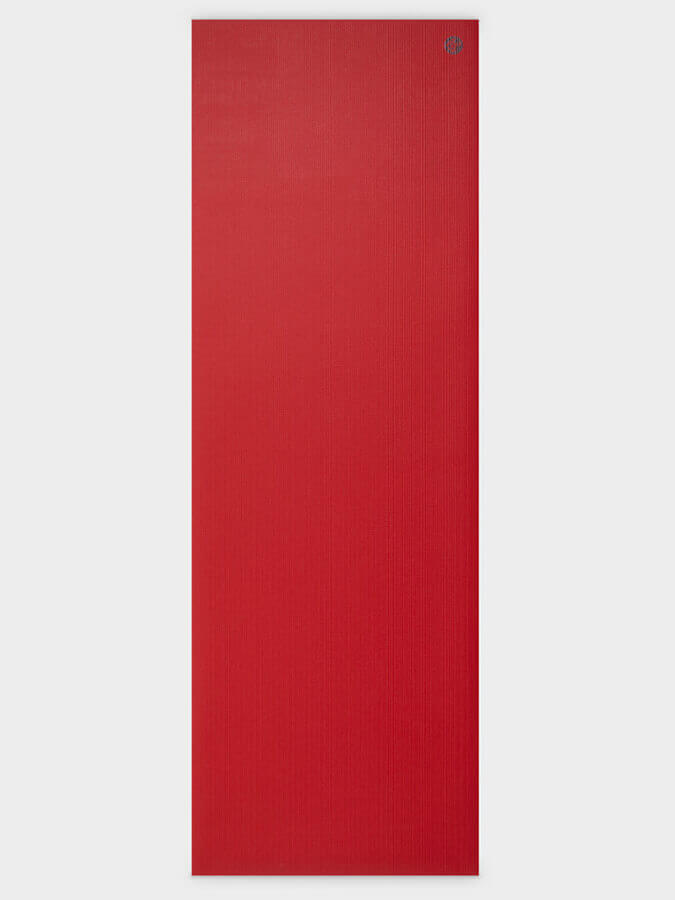 Red yoga mat on a white background
