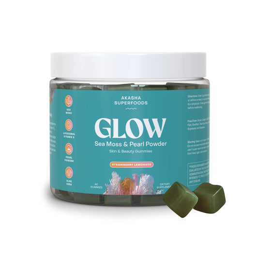 Jar of Akasha Superfoods Glow Sea Moss & Pearl Powder with two gummies on a white background