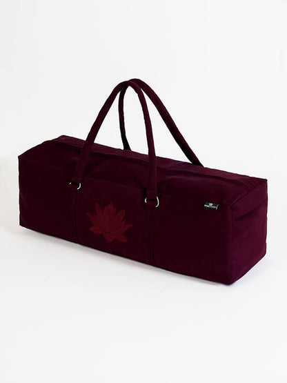 Maroon duffel bag with a leaf design on a white background