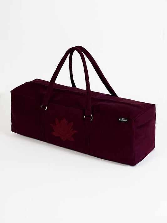 Maroon duffel bag with a leaf design on a white background