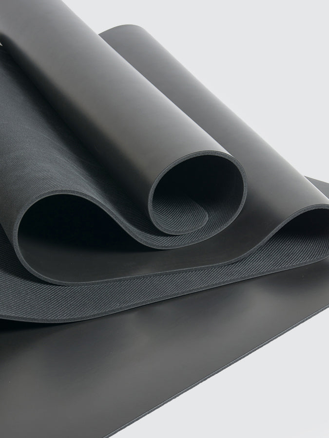 Roll of gray fabric on a light gray background