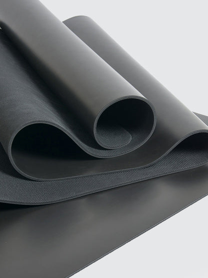 Roll of gray fabric on a light gray background