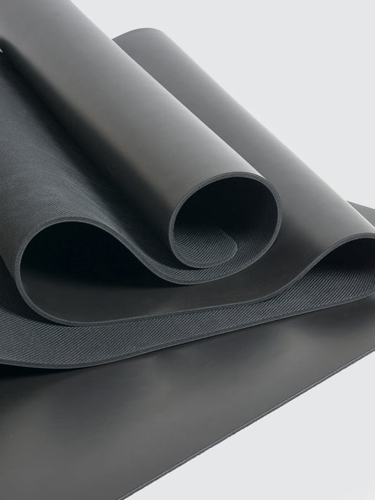 Roll of gray fabric on a light gray background