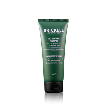 Green tube of Brickell Men's Products shampoo on a white background