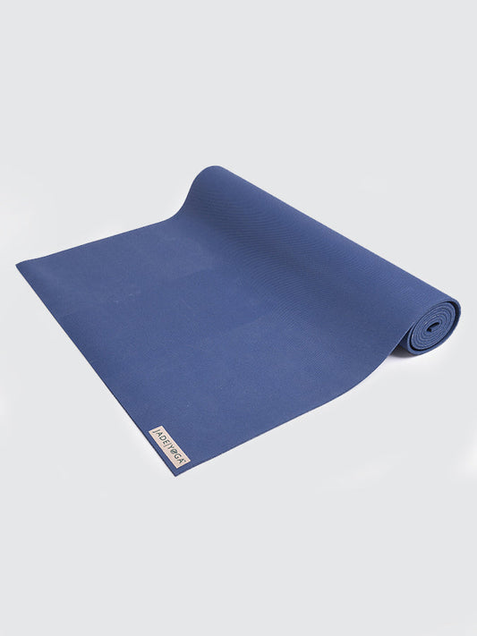 Rolled-up blue yoga mat on a light gray background
