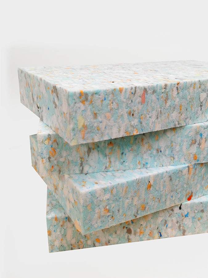 Stack of textured paper sheets on a white background