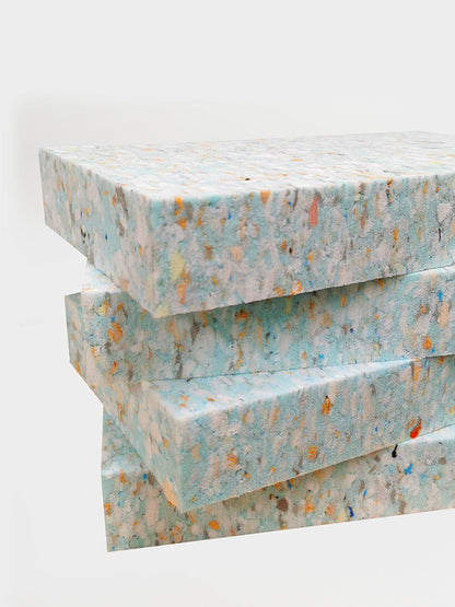 Stack of textured paper sheets on a white background