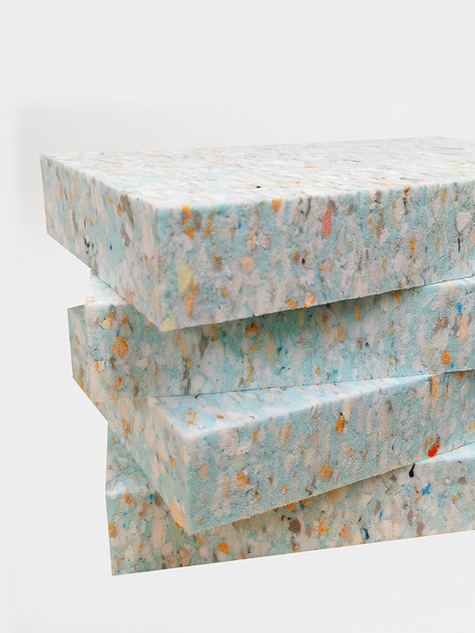 Stack of textured paper sheets on a white background