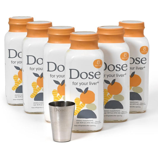 Multiple bottles of 'Dose for your liver' supplement with a metal tumbler on a white background