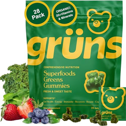 Green package of grüns Superfoods Greens Gummies with vitamins and minerals, surrounded by fresh fruits and vegetables.