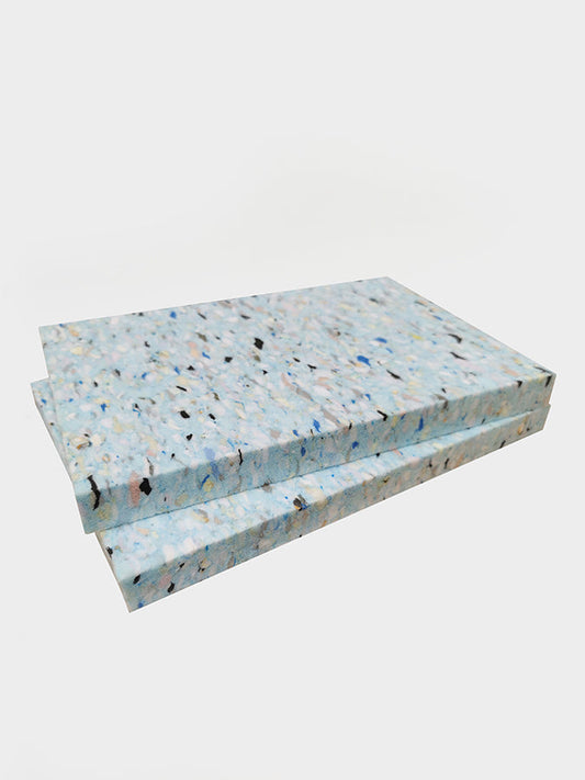 Two concrete slabs with a speckled pattern on a white background