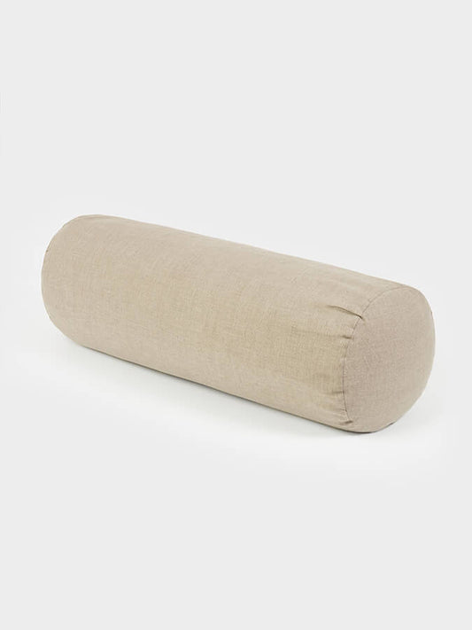 Beige cylindrical pillow on a white background