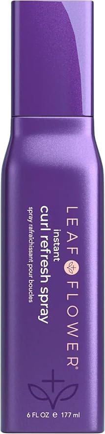Purple spray bottle labeled 'Leaf Flower' on a white background