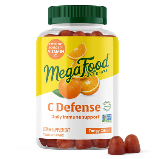 MegaFood C Defense supplement bottle with orange flavor on a white background