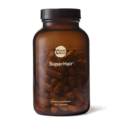 Bottle of Moon Juice SuperHair dietary supplements on a white background