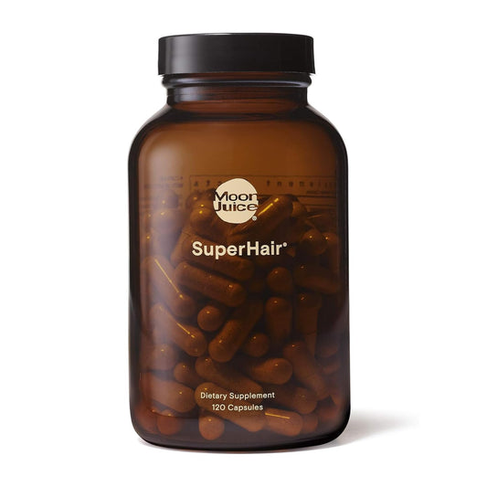 Bottle of Moon Juice SuperHair dietary supplements on a white background