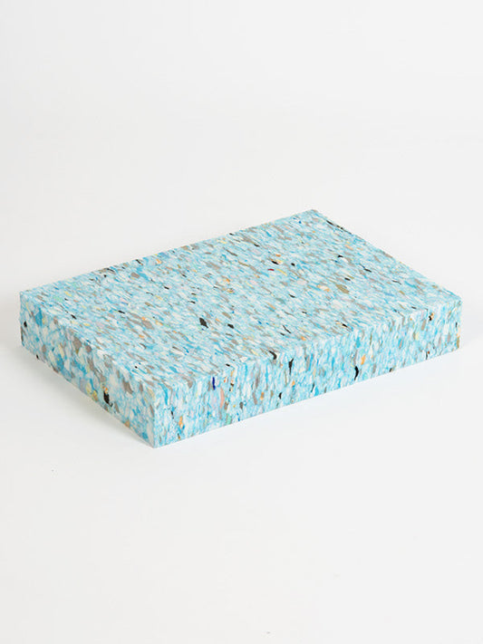 Rectangular blue mosaic tile on a white background