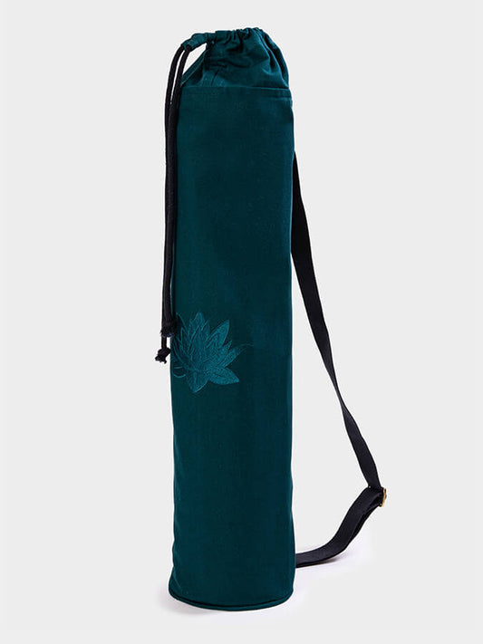 Teal yoga mat bag with a floral design on a white background