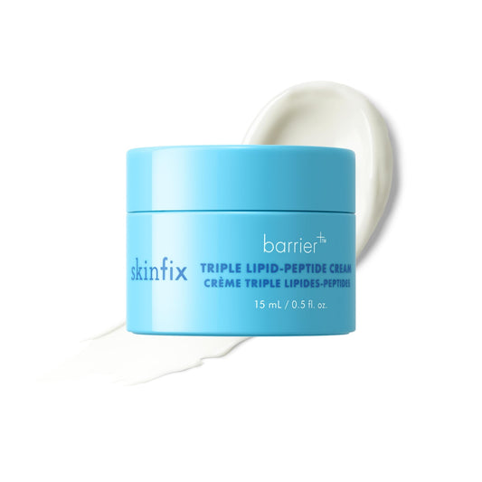 Blue jar of skinfix barrier cream on a white background