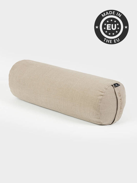Beige yoga bolster with 'Made in EU' label on a white background