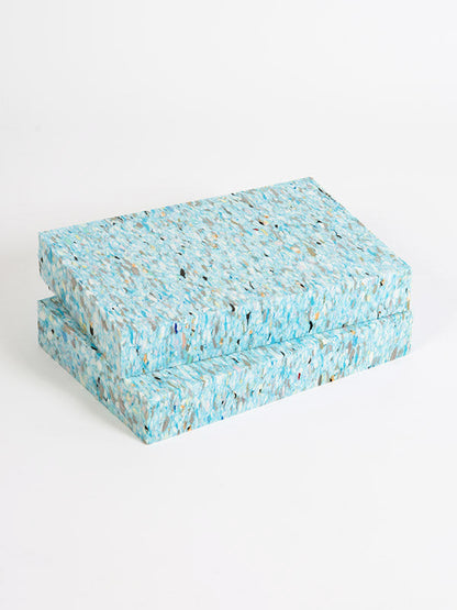 Two blue textured boxes stacked on a white background